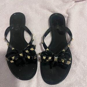 Black flip flops with gold detail size 38